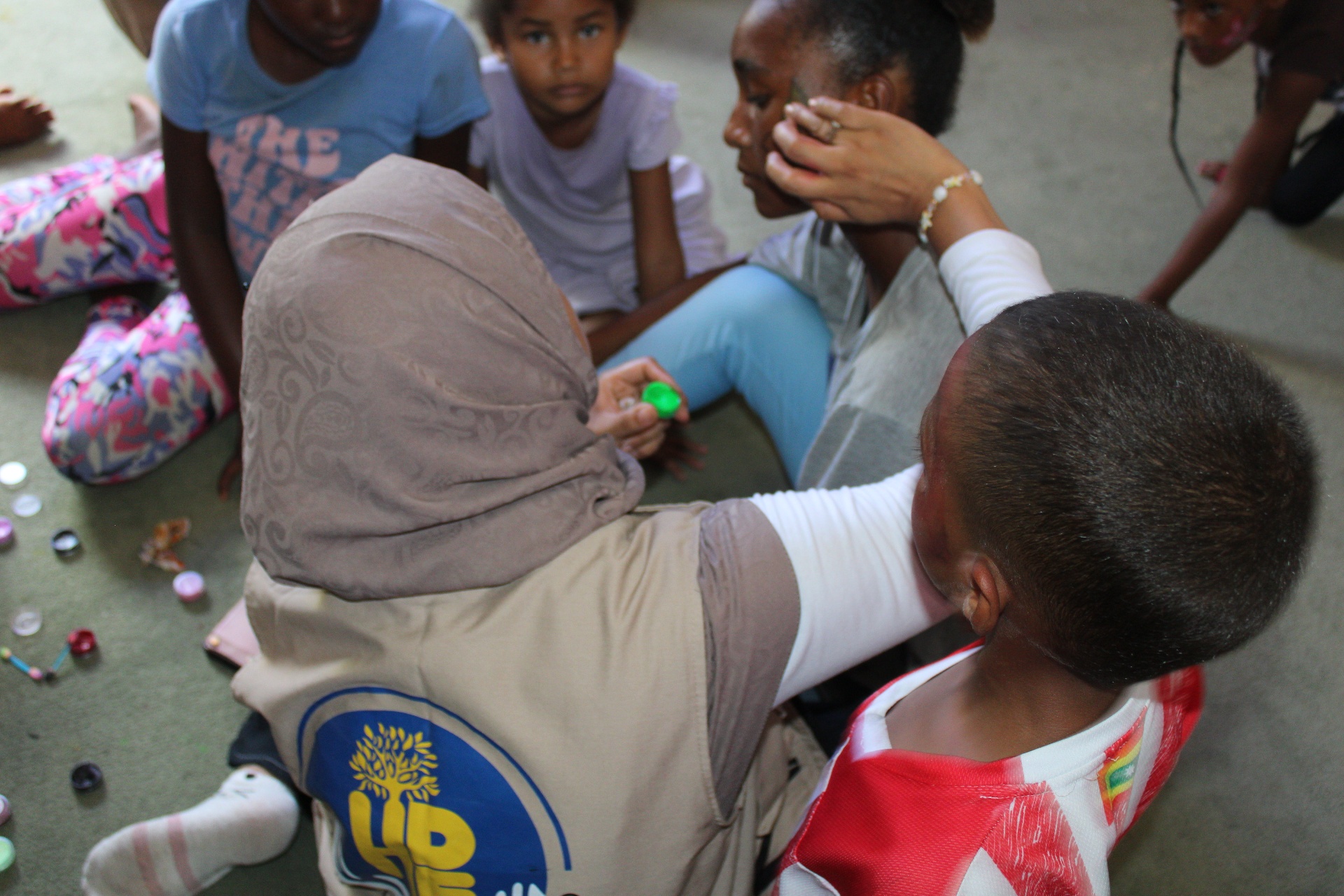 An HDF volunteer painting a child's face during the Eid celebration in Cartagena, Colombia.